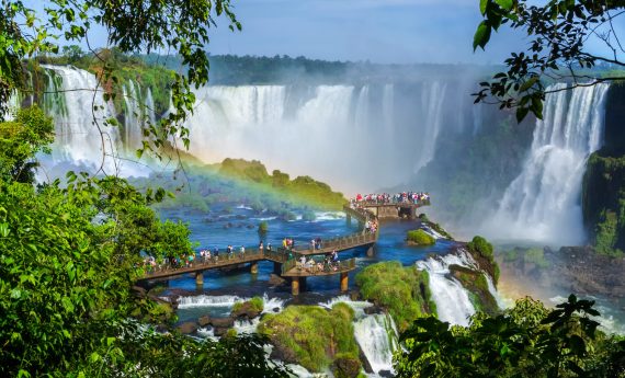 Tourists,At,Iguazu,Falls,,One,Of,The,World's,Great,Natural